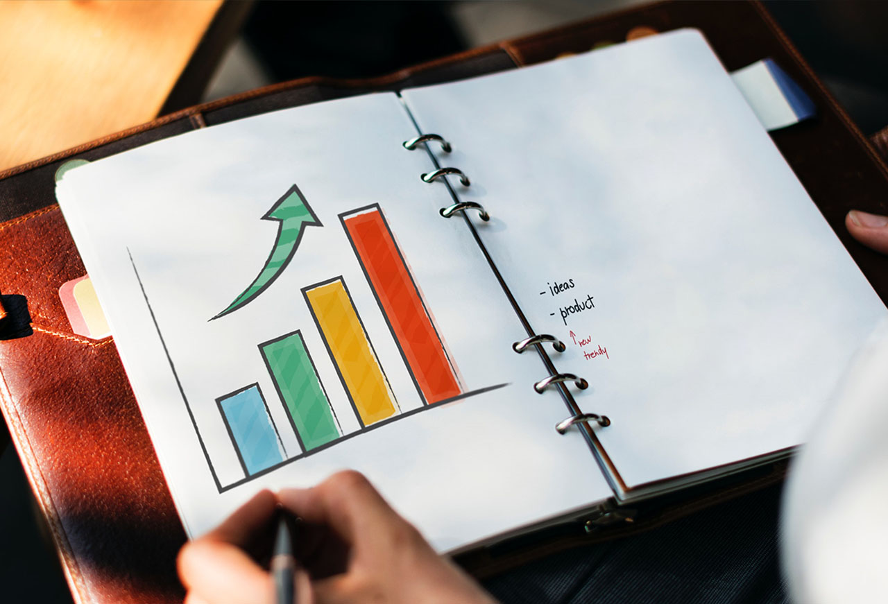 A colorful bar graph on a notebook
