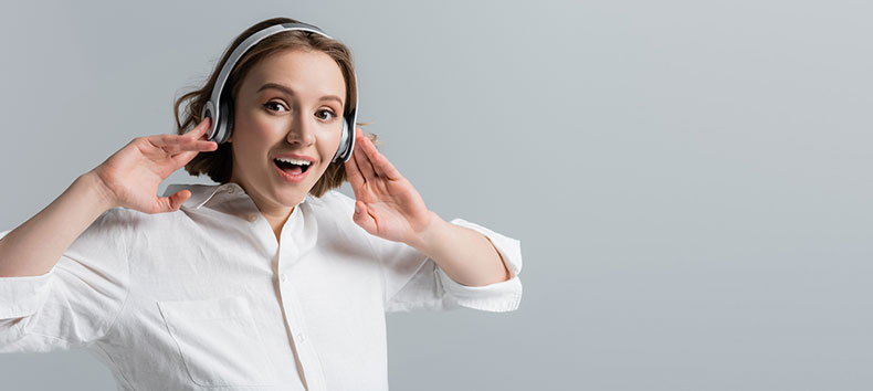 a woman listening to audiobooks on her headphones